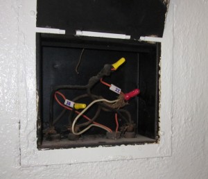 An old junction box with old and older wiring. Scary.