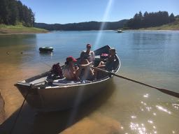 family eating snacks on the boat